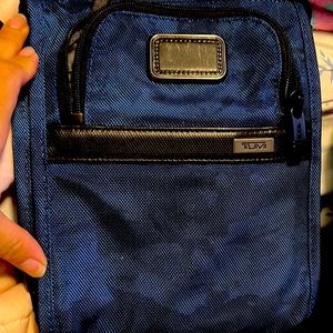 Tumi leather stitch crossbody bag.  Brand new condition.  Men or women